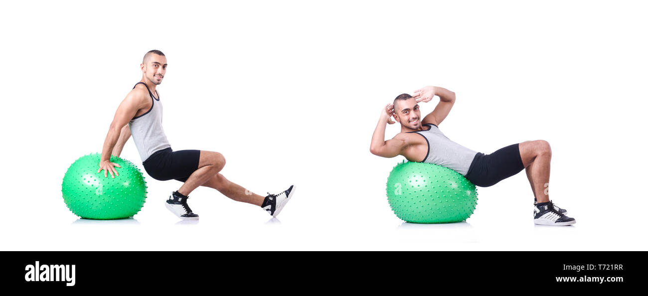 Man with swiss ball doing exercises on white Stock Photo - Alamy