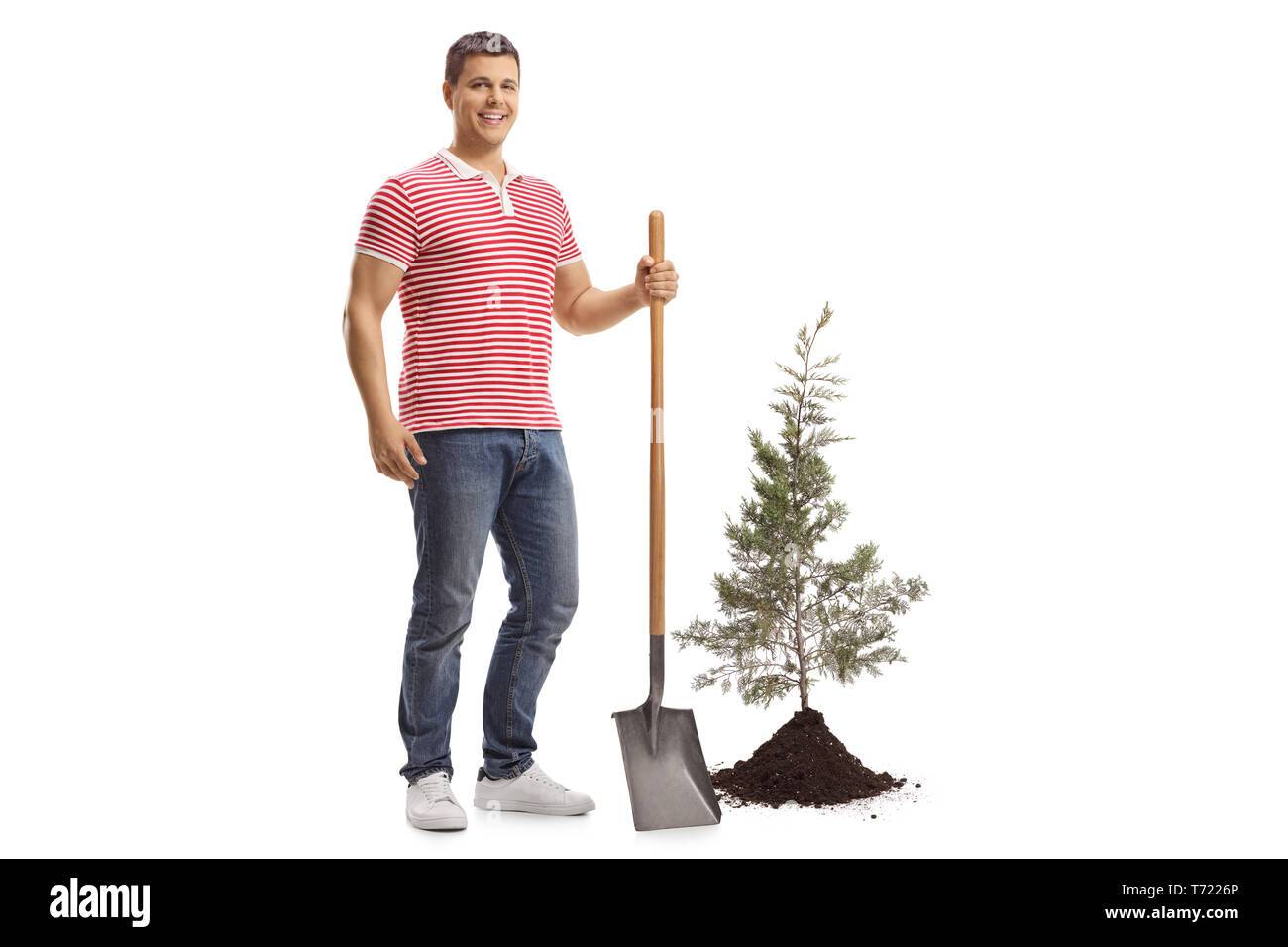 Full length portrait of a young handsome man with a shovel and a ...