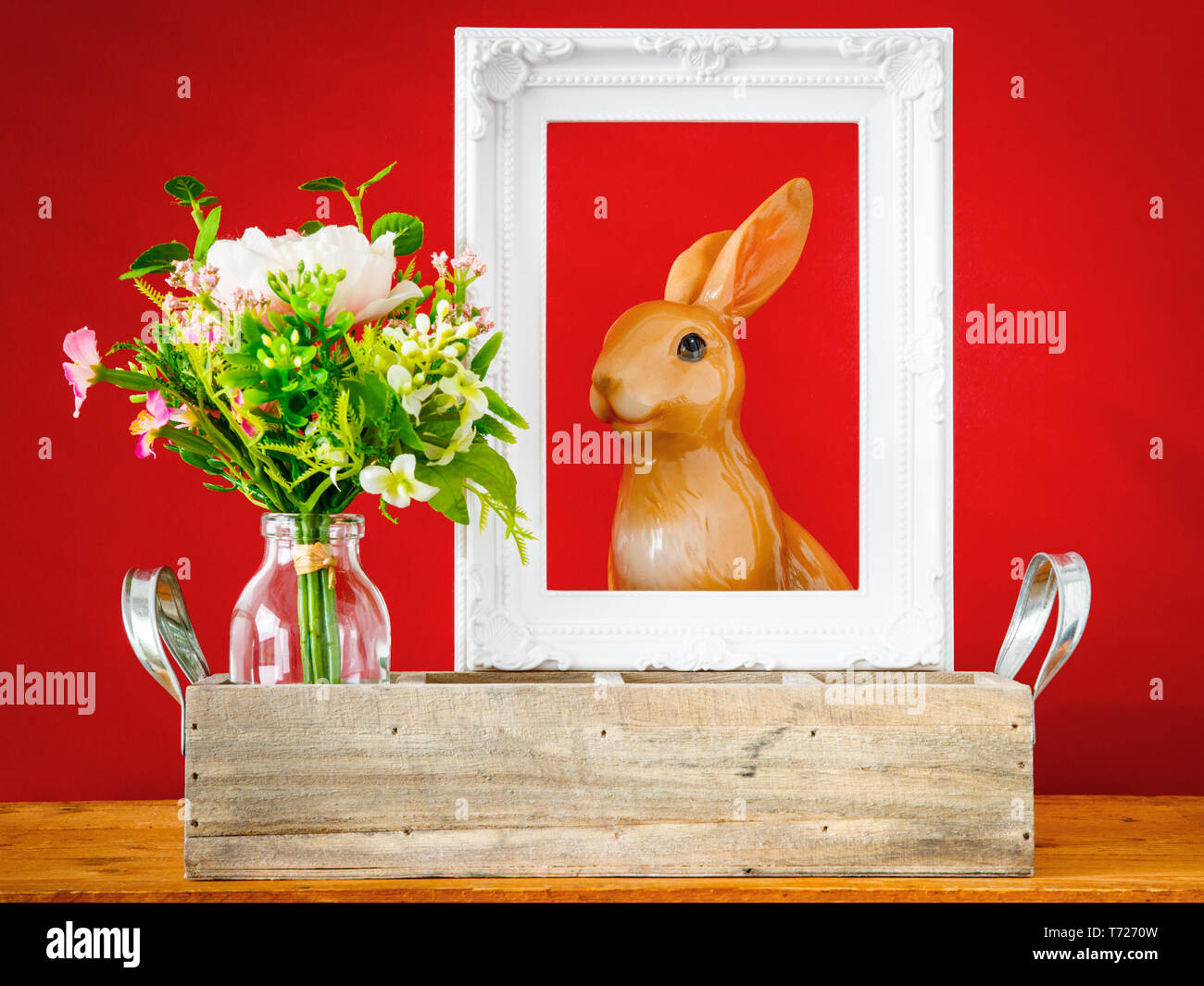 artificially bunch of flowers easter bunny holiday decoration background Stock Photo