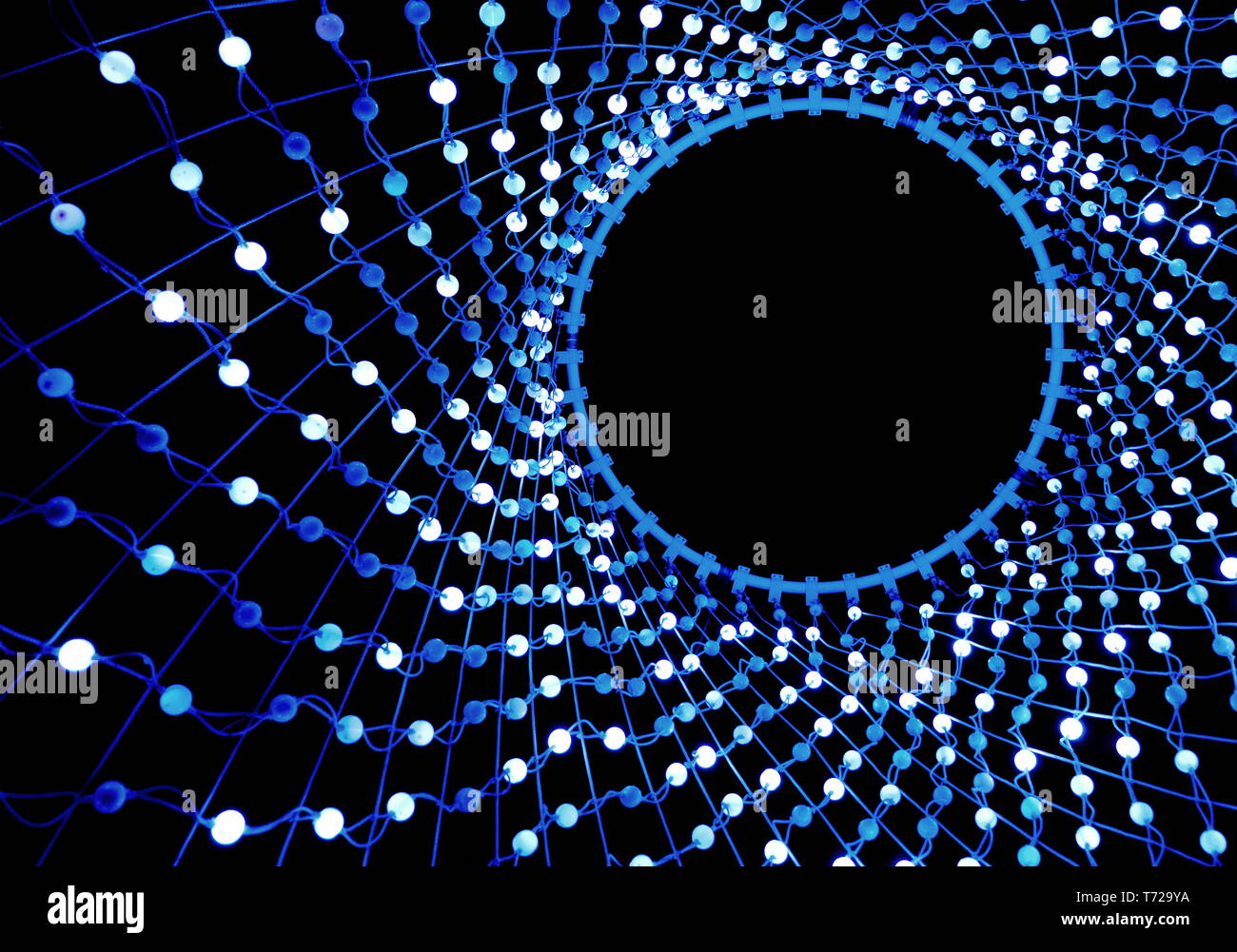 Colorful lights in a circle shaped net Stock Photo