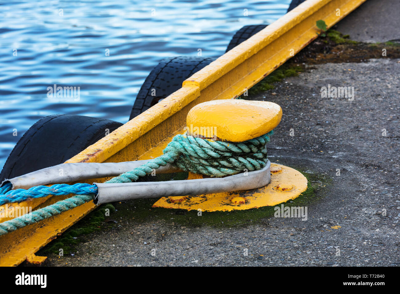 mooring pole braided with mooring ropes Stock Photo Alamy