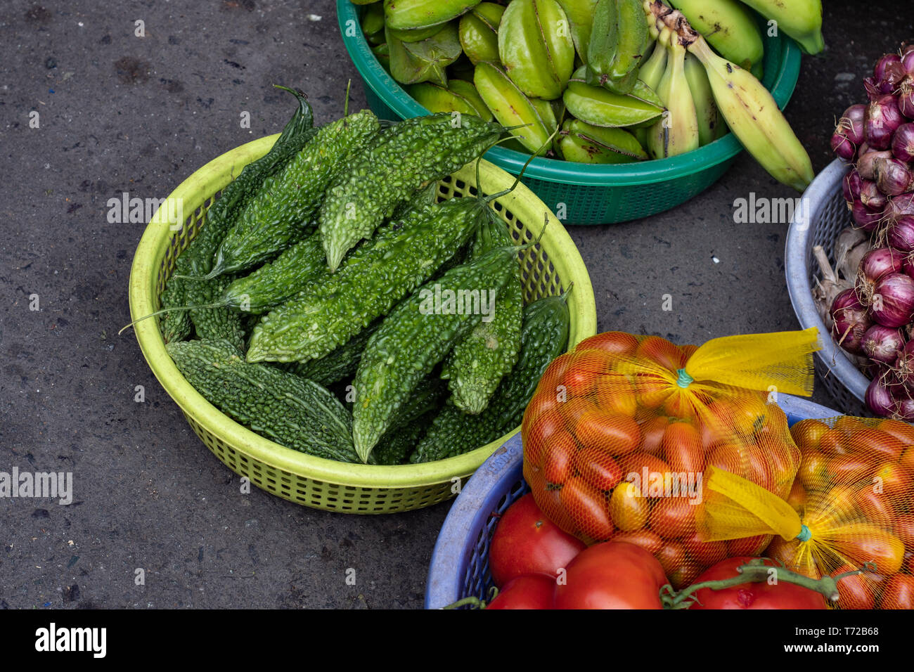 Superfoods showing bitter gourd, star fruit, bananas, red onion and