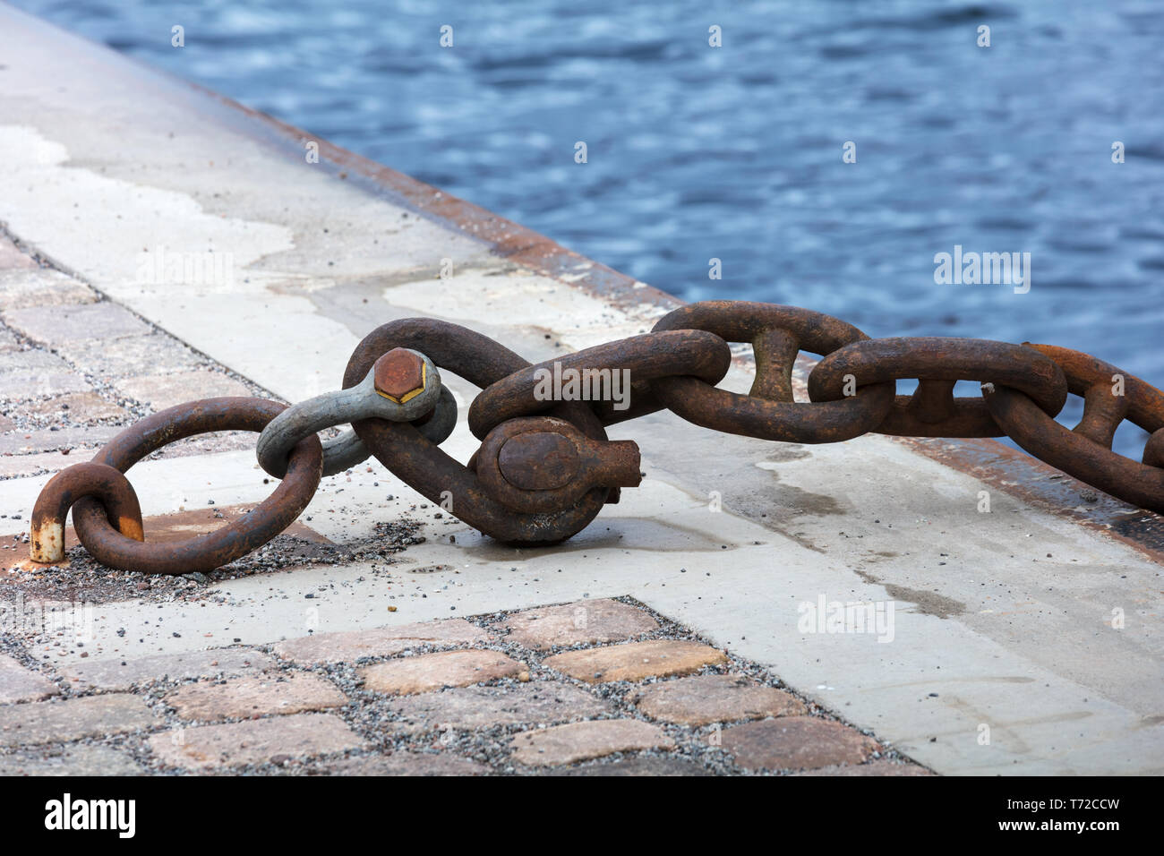 old rusty chain in harbor Stock Photo