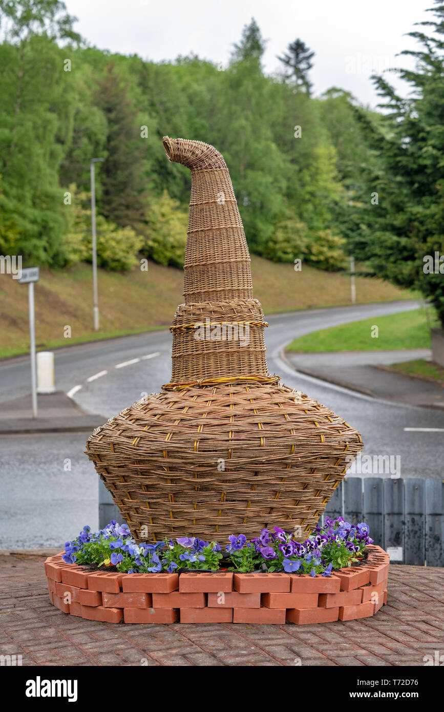 This is a hand made Willow Whisky Still situated on a roundabout in the  village of Rothes, Speyside, Moray, Scotland Stock Photo - Alamy