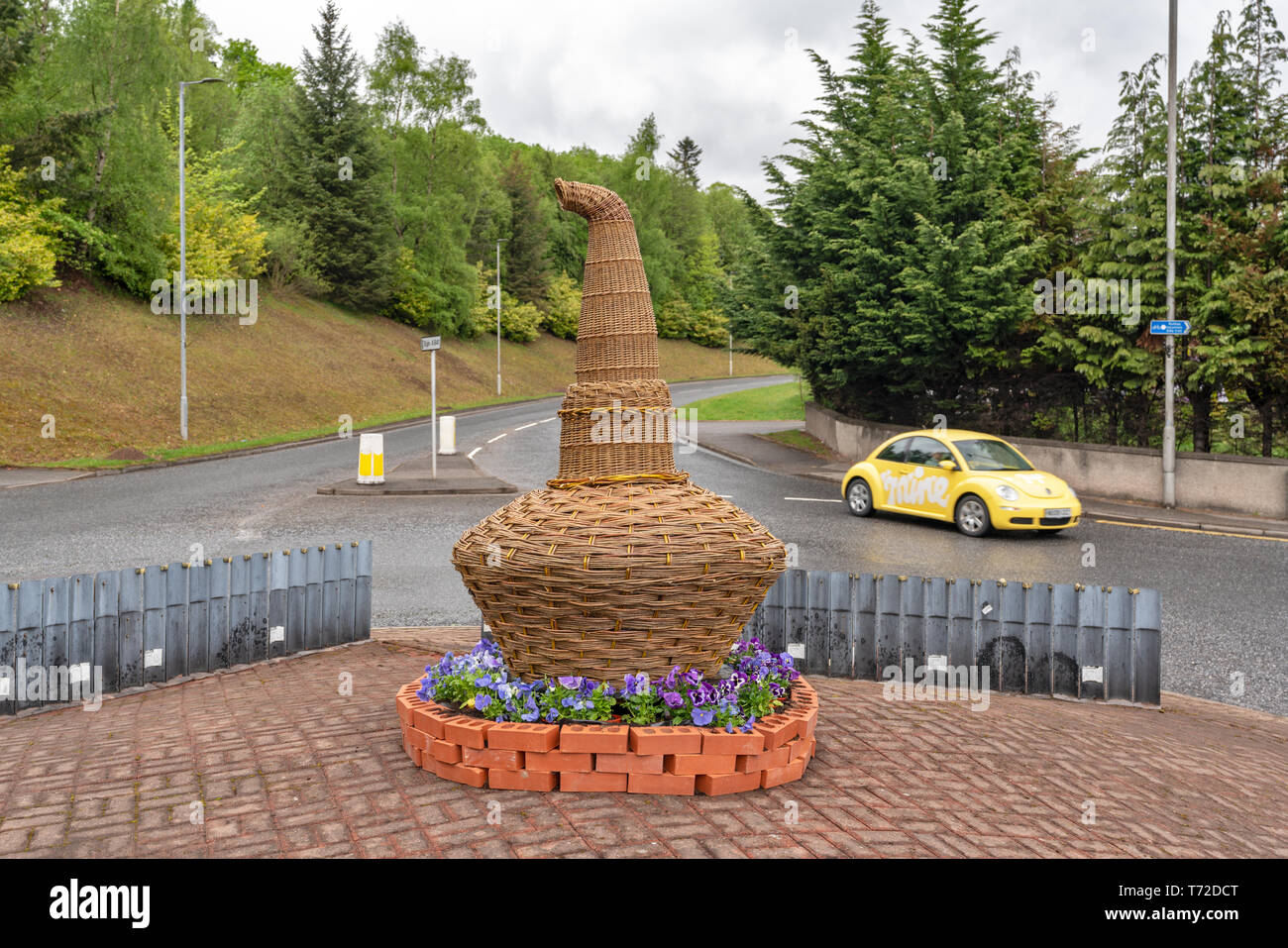 This is a hand made Willow Whisky Still situated on a roundabout in the village of Rothes, Speyside, Moray, Scotland. Stock Photo