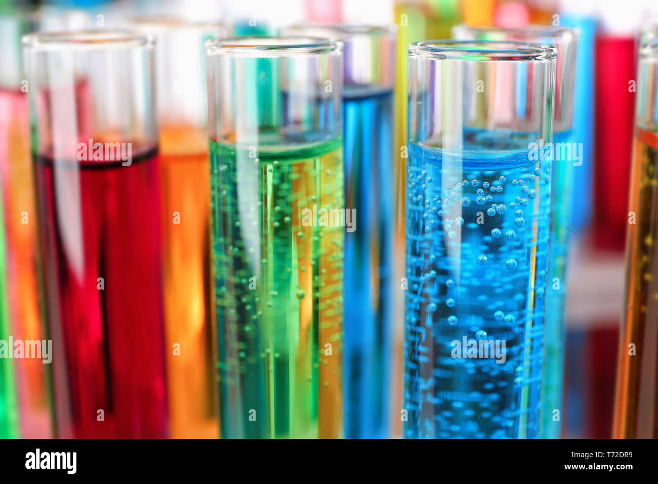Many test tubes with colorful liquids, closeup Stock Photo - Alamy