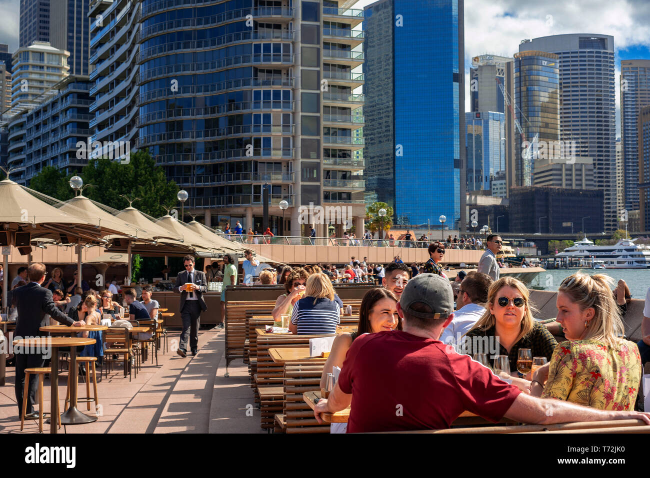 Bars and restaurants in the promenade Circular Quay next to the Opera House in Sydney, Australia Stock Photo