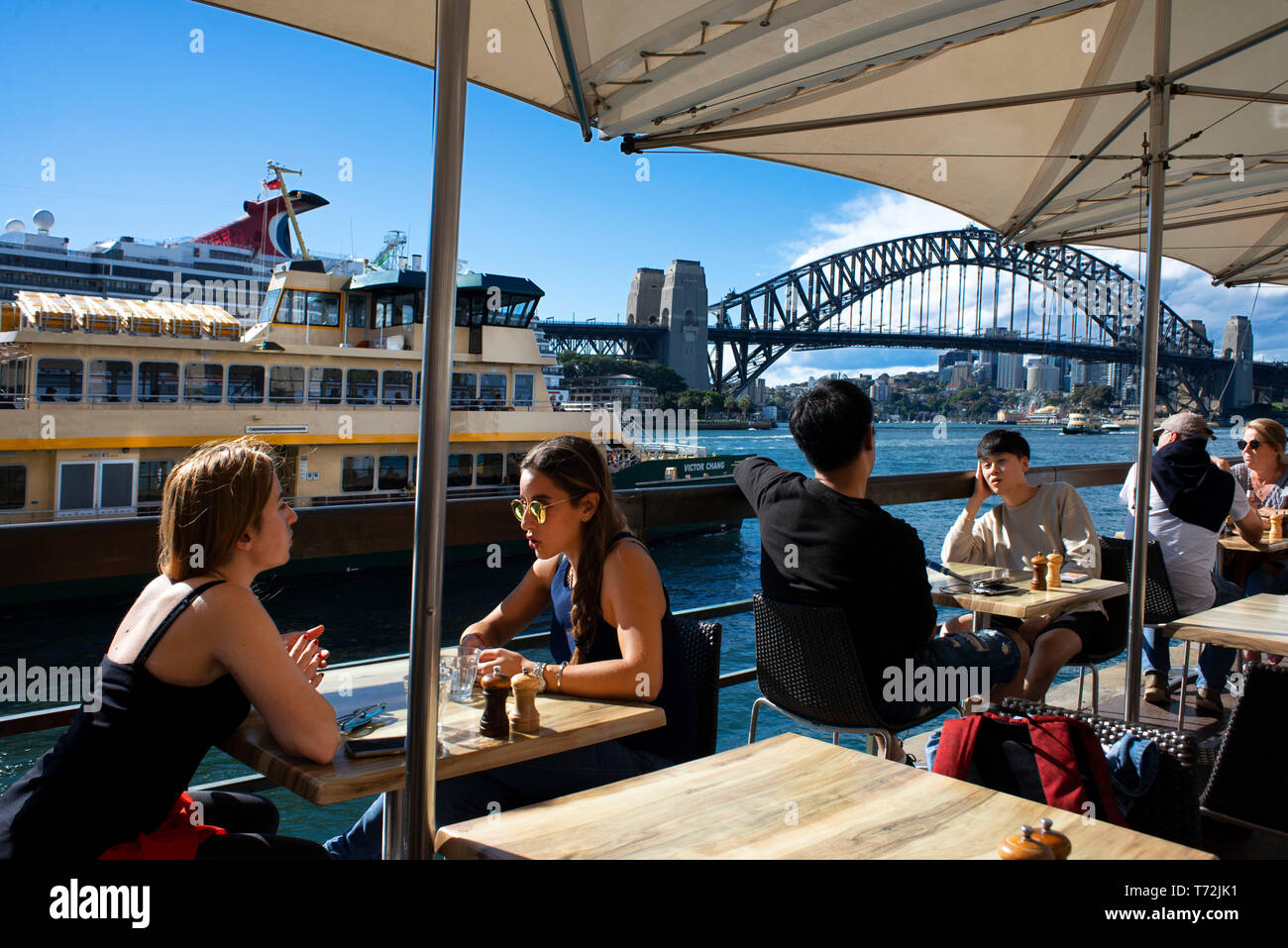 Bars and restaurants in the promenade Circular Quay of Harbour Bridge in Sydney, Australia Stock Photo
