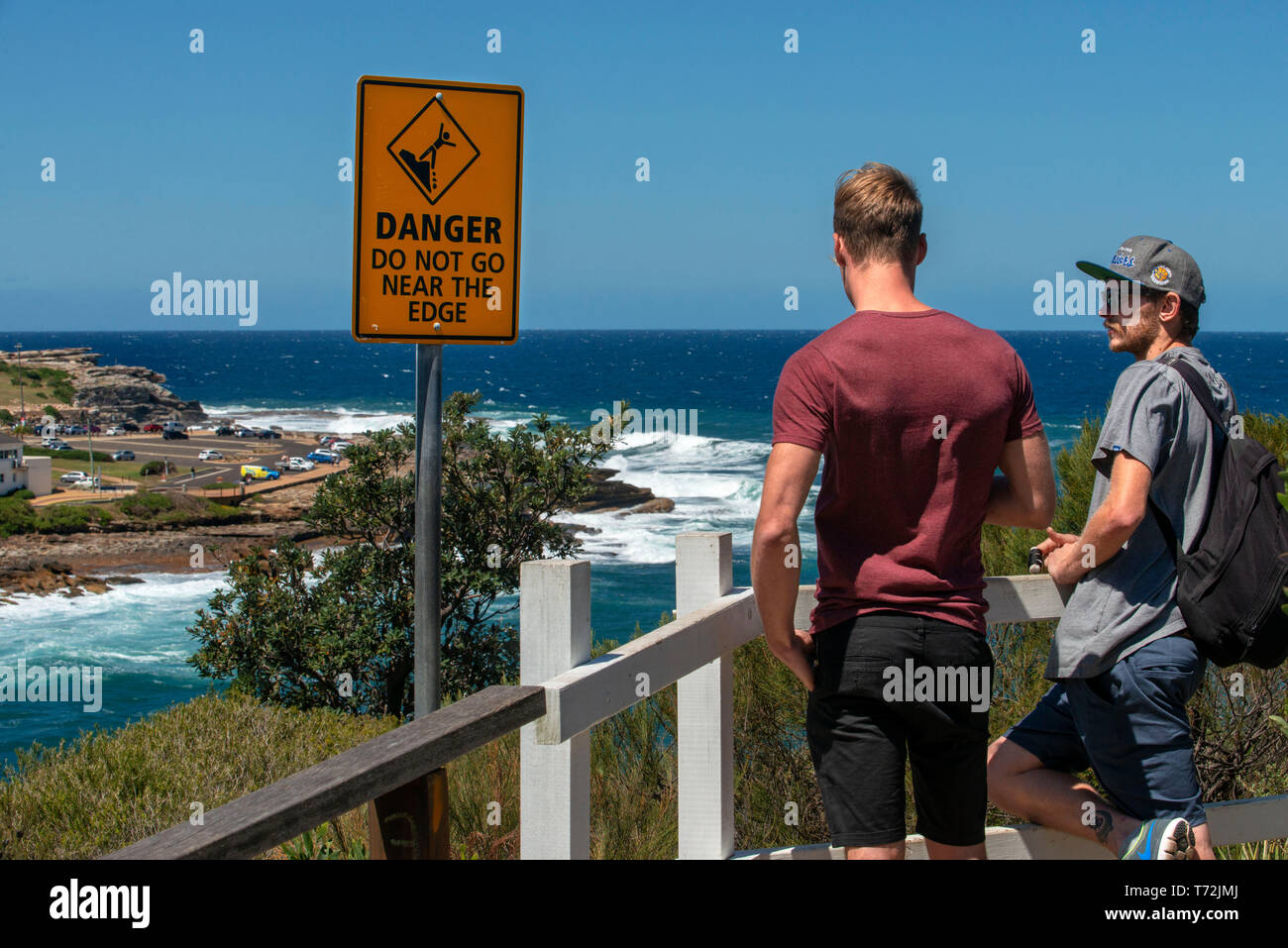 The Bondi beach to Coogee walk is a coastal walk in Sydney New South Wales, Australia. Tourists near Gordons Bay. Stock Photo