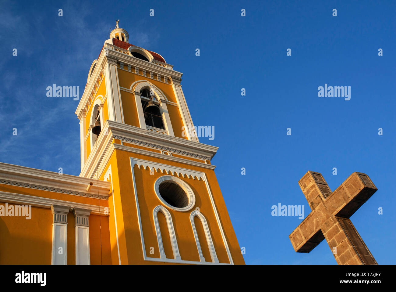 A view of the bright yellow and very colorful Cathedral of Granada in Nicaragua Central America Stock Photo