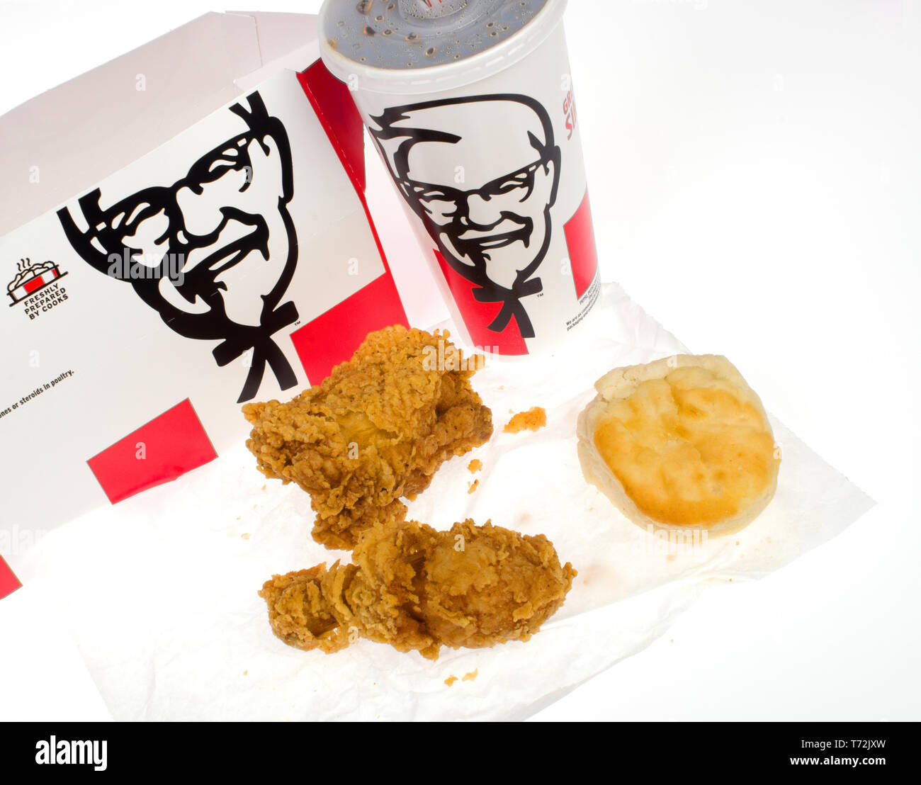 Kentucky Fried Chicken, KFC, box meal $5 Fill Up with a crispy fried chicken thigh and drumstick and biscuit with soda cup Stock Photo