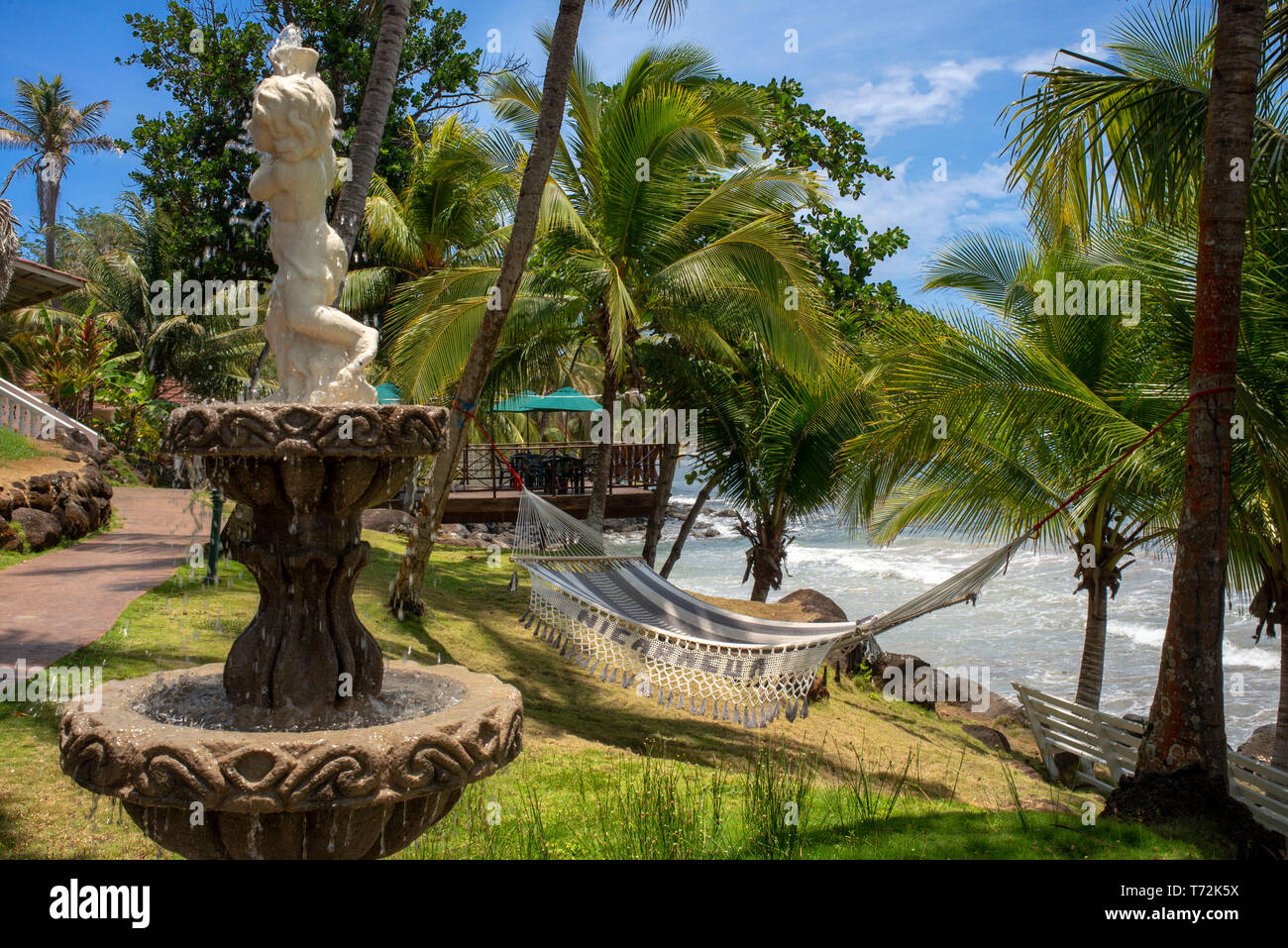 Hammock and fountain at Casa Canada hotel on Big Corn Island, Nicaragua, Central America Stock Photo