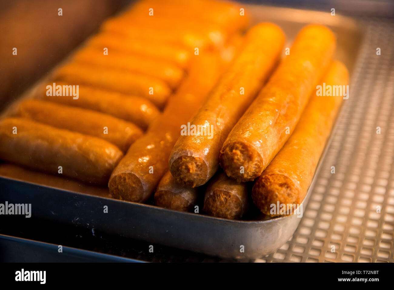 Traditional large sausages in a British traditional chip shop or chippy or Chippie Stock Photo