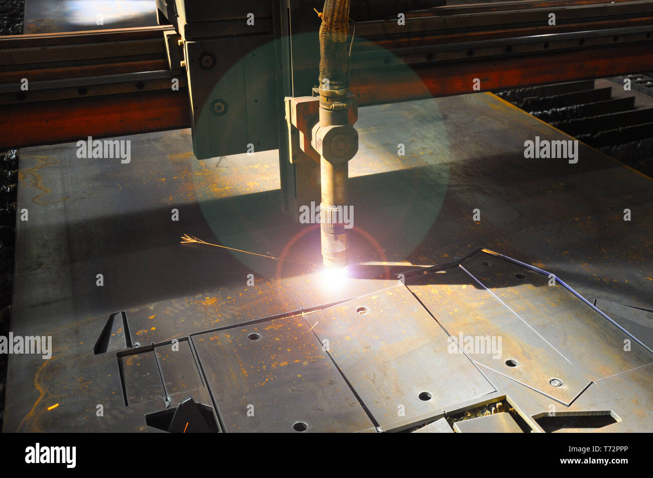 laser cutting torch machine in an industrial plant cuts sheet metal