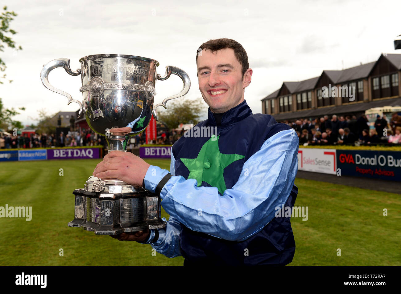 Niall Redmond with the cup after winning the KFM Hunters Chase For The Bishopscourt Cup onboard Flirting Lesa during day four of the Punchestown Festival at Punchestown Racecourse, County Kildare, Ireland. Stock Photo