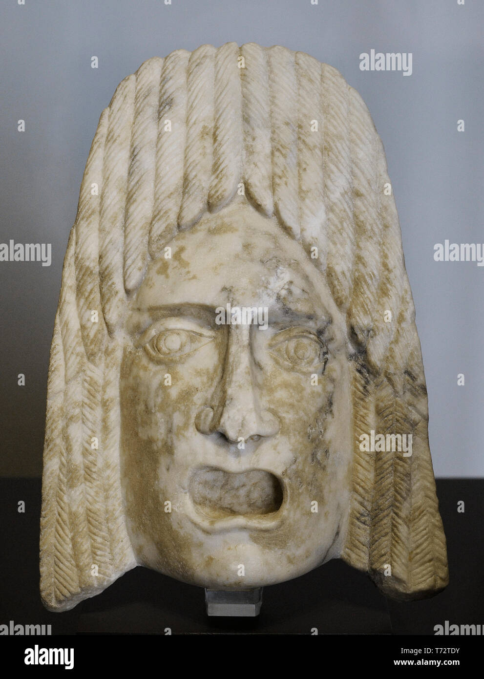 Tragic mask. Architectural element. 1st-2nd century AD. Marble. From Bañuelas (Avila province, Castile and Leon, Spain). National Archaeological Museum. Madrid. Spain. Stock Photo
