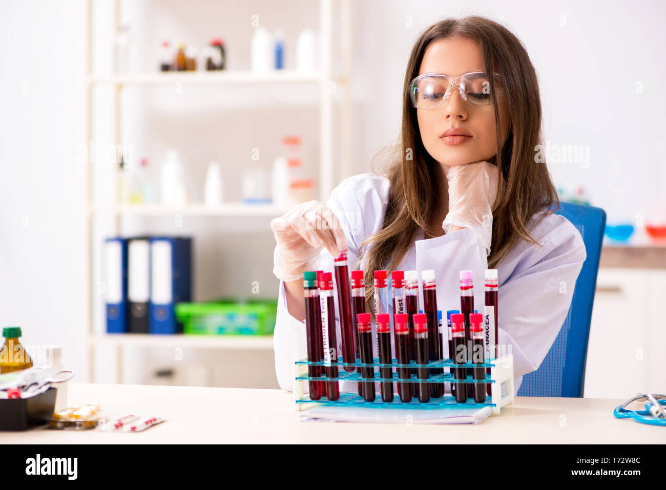 Young biochemist testing blood hi-res stock photography and images - Alamy