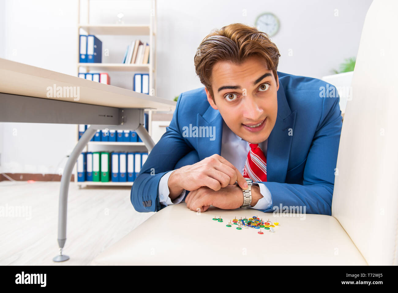 Office prank with sharp thumbtacks on chair Stock Photo Alamy