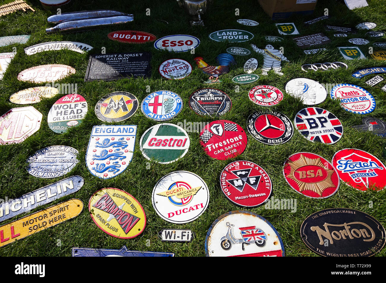 Display of old signs and badges at car boot sale Stock Photo