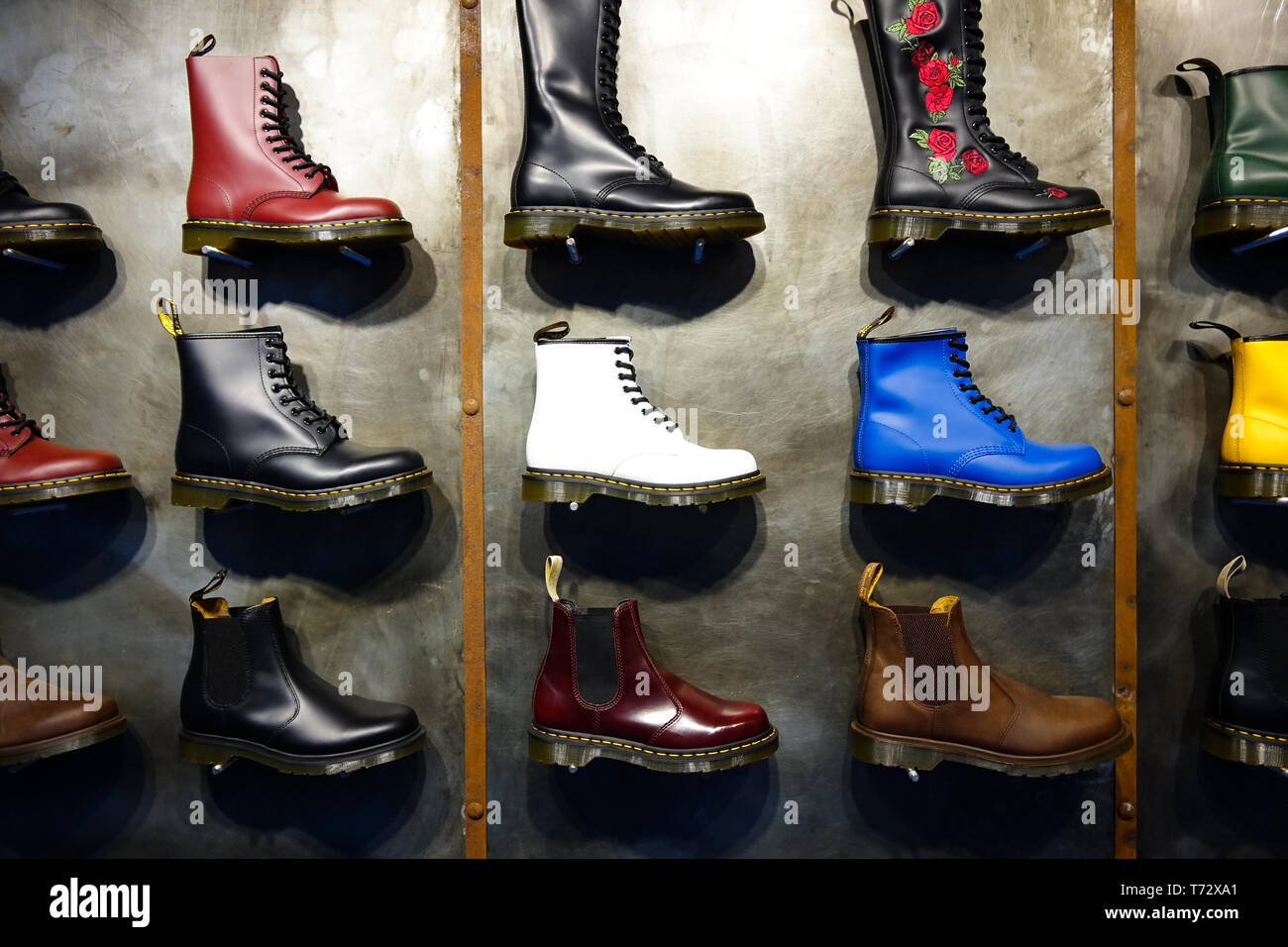 Window display of colourful Dr Marten boots Stock Photo