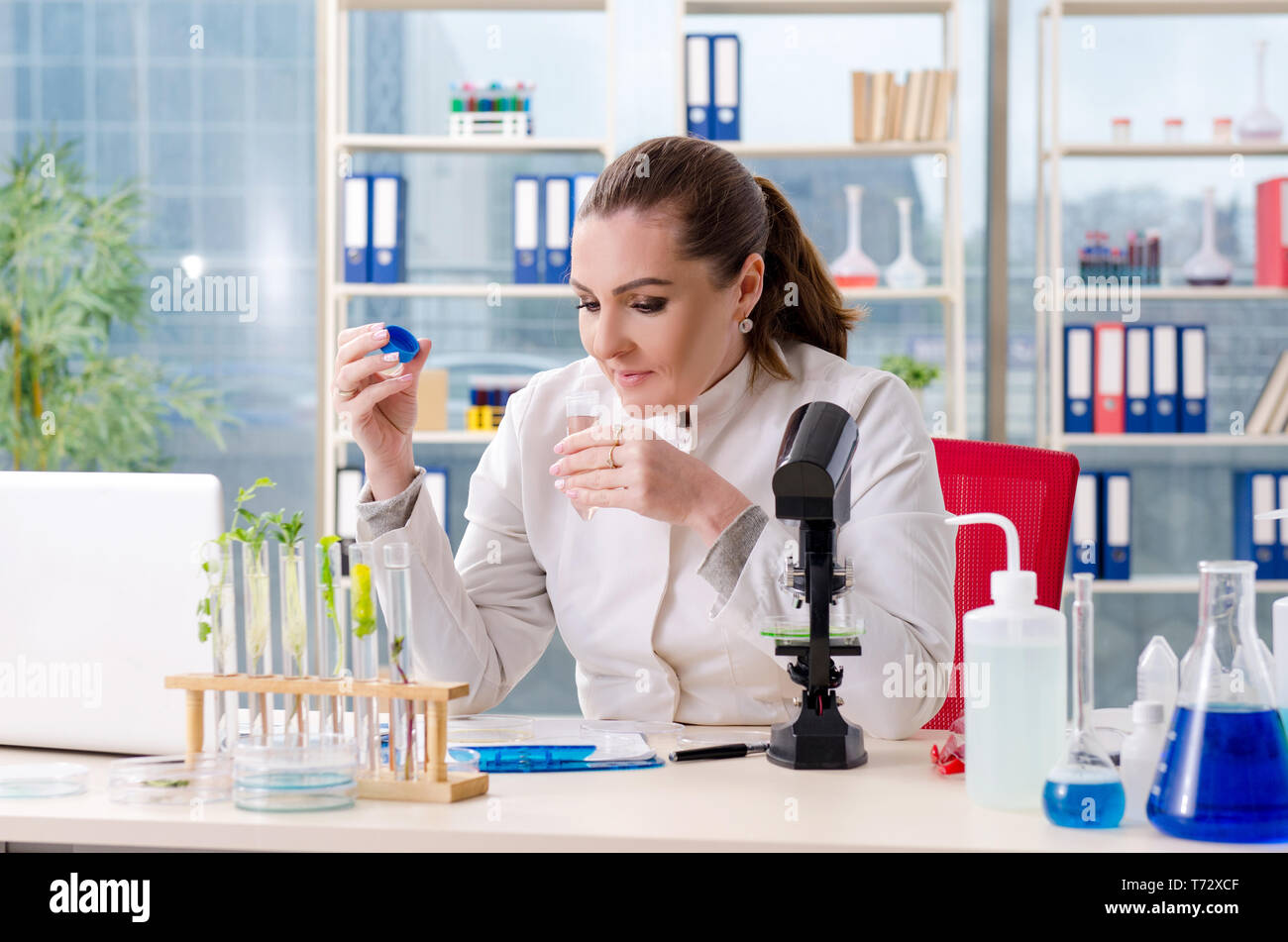 Female scientist analyzing liquid extract hi-res stock photography and ...
