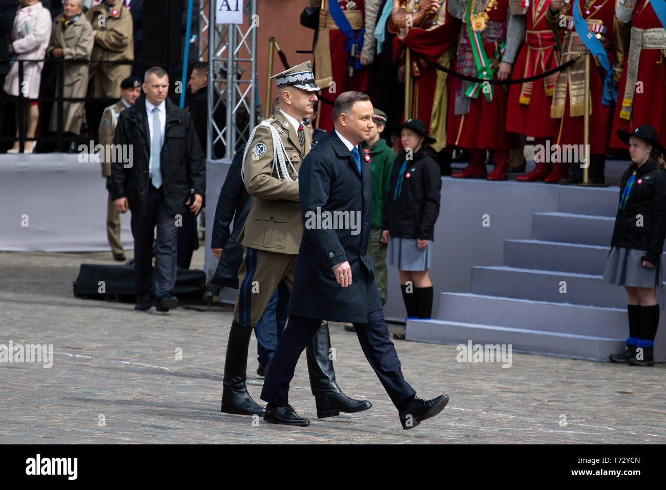Polish President Andrzej Duda seen marching accompanied by a soldier during the occasion. Celebration of the Constitution Day, May 3 at the Castle Square. Ceremonial military parade on the occasion of the celebration. Stock Photo