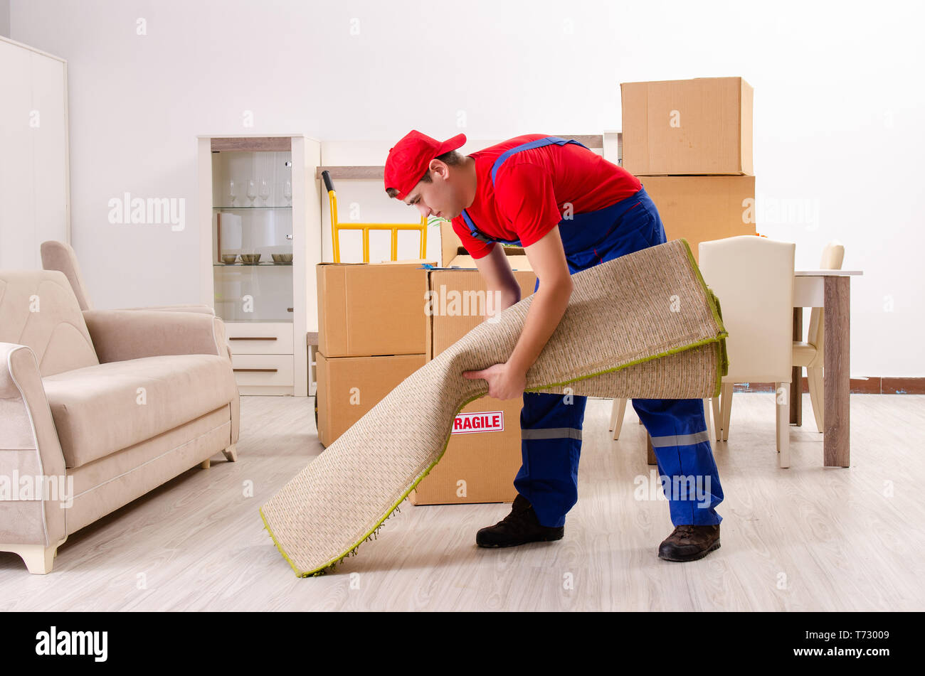 Young contractor boxes working hi-res stock photography and images - Alamy