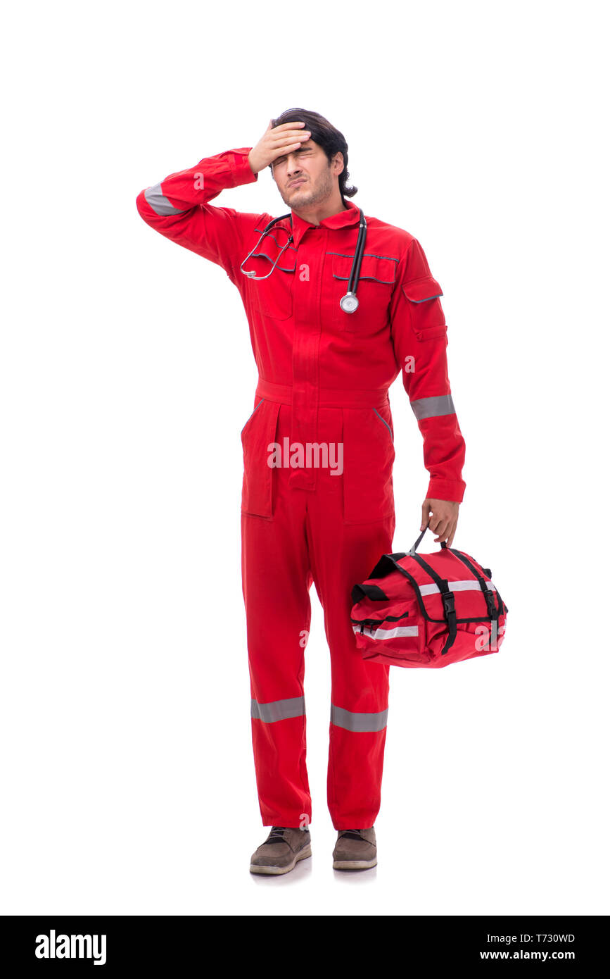 Young paramedic in red uniform isolated on white Stock Photo