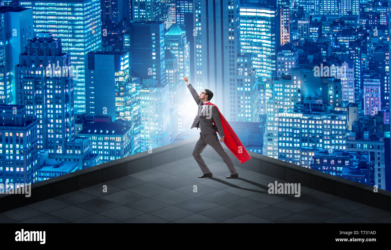 Superhero businessman on top of building Stock Photo - Alamy
