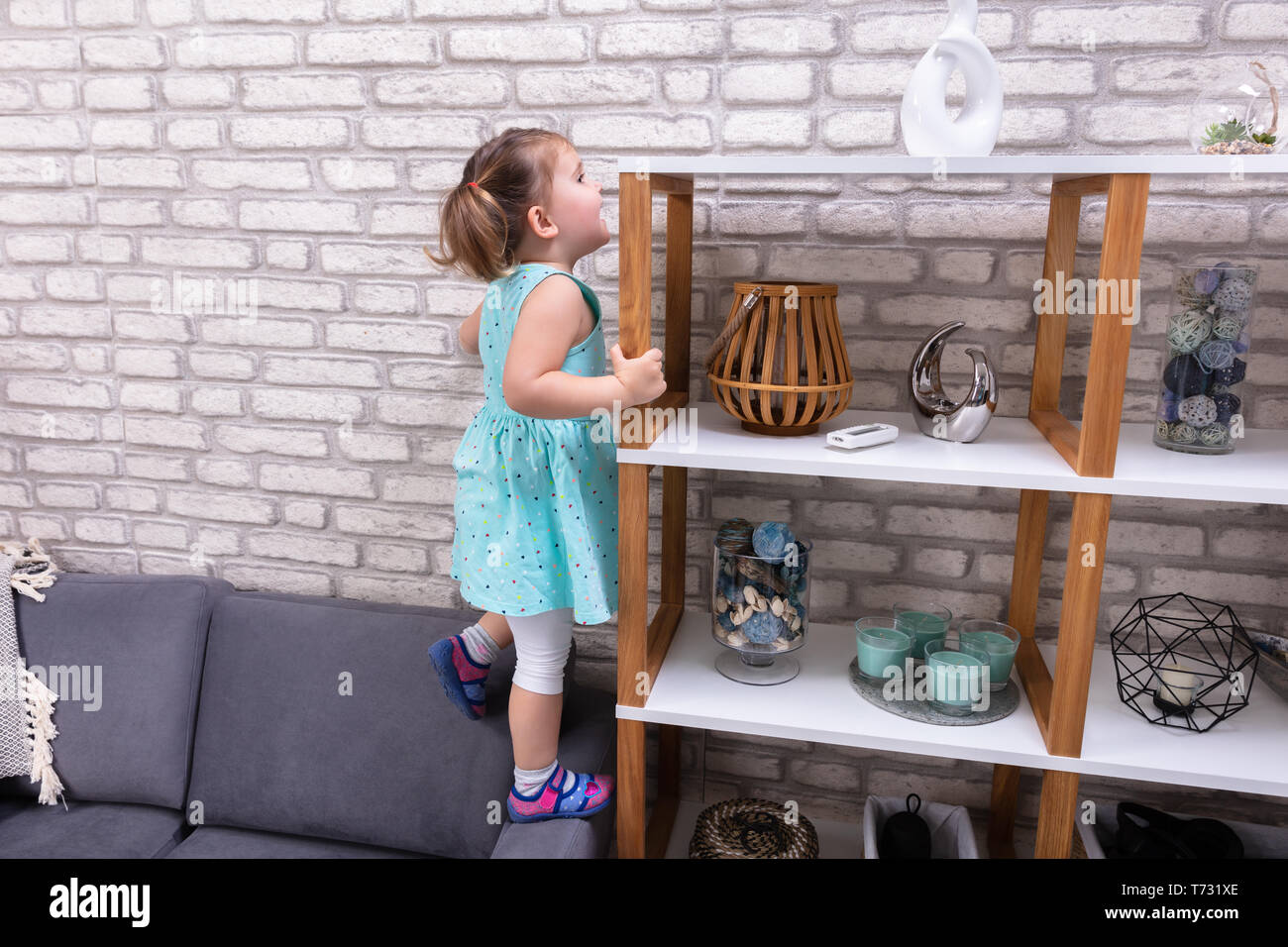 Children climbing on sofa hires stock photography and images Alamy
