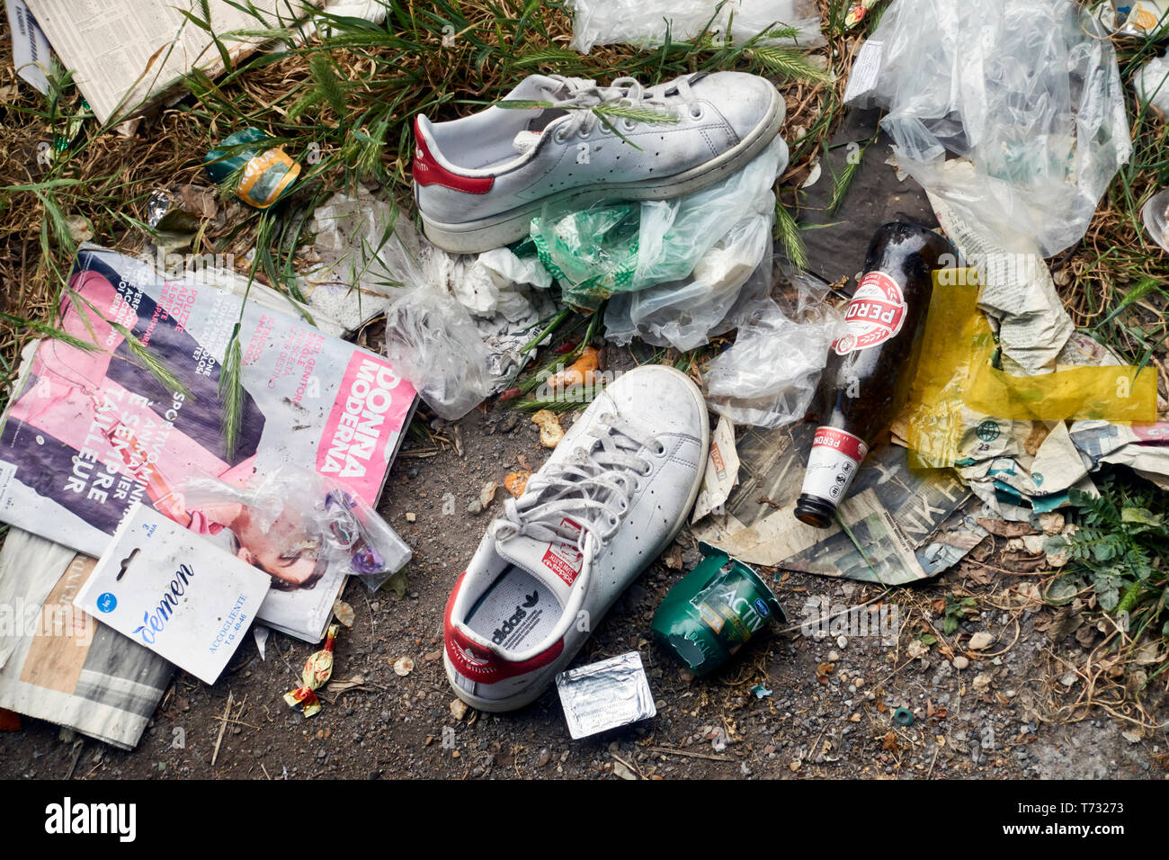 Garbage abandoned with a pair of Adidas sneakers shoes Stock Photo - Alamy