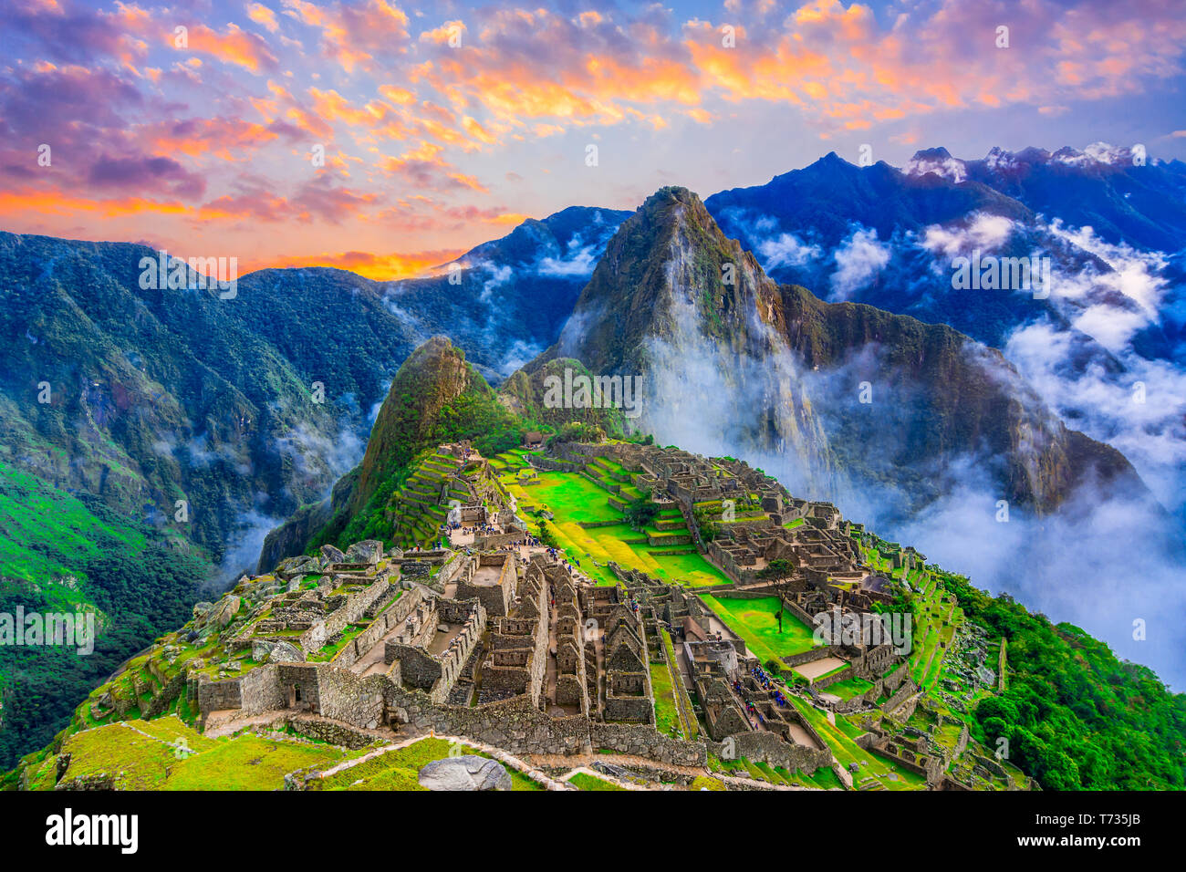 Machu Picchu, Cusco,Peru: Overview of the lost inca city Machu Picchu, agriculture terraces and Wayna Picchu, peak in the background,before sunrise Stock Photo