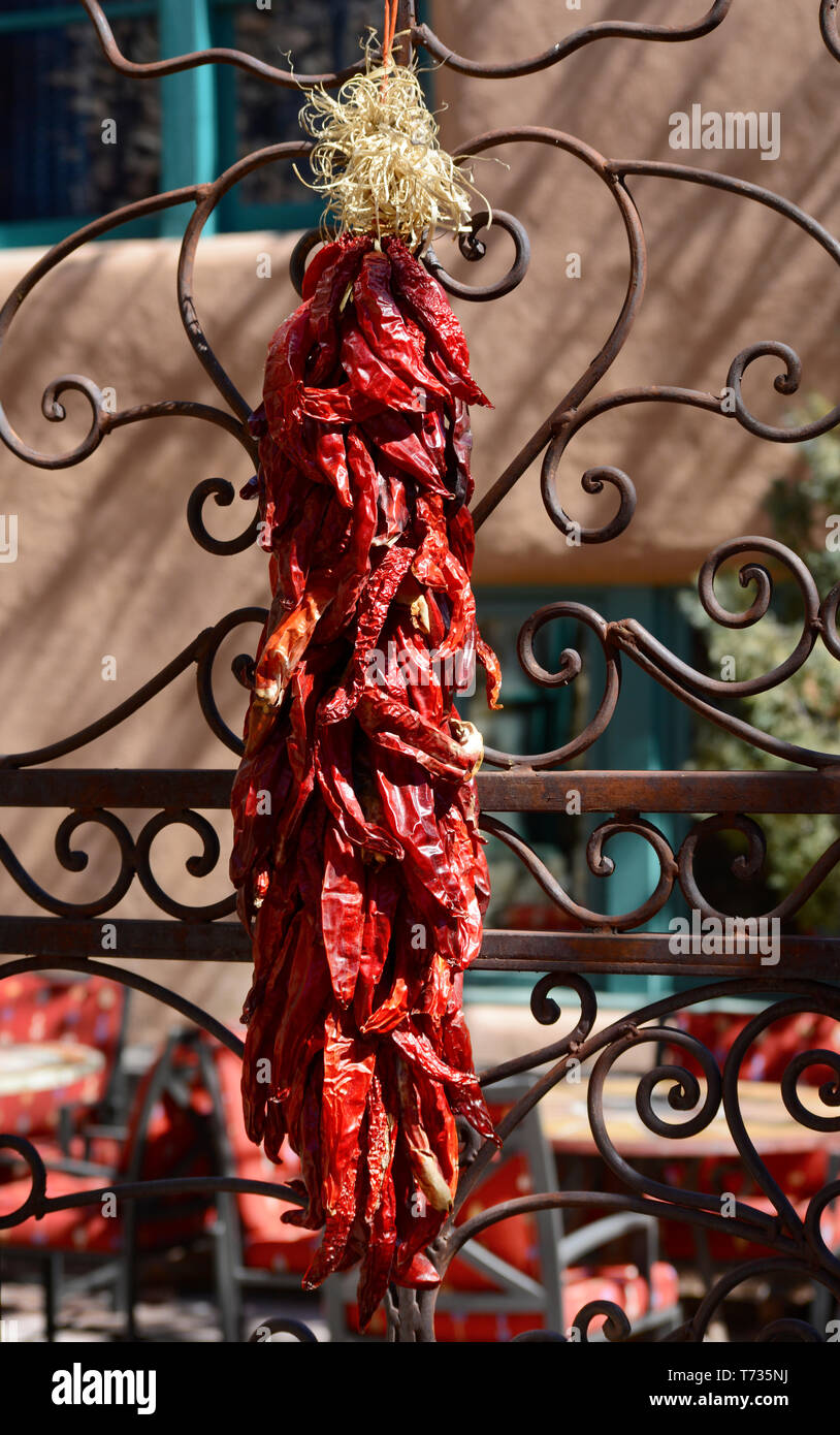 Strings of decorative dried red Chile peppers called ristras hanging in