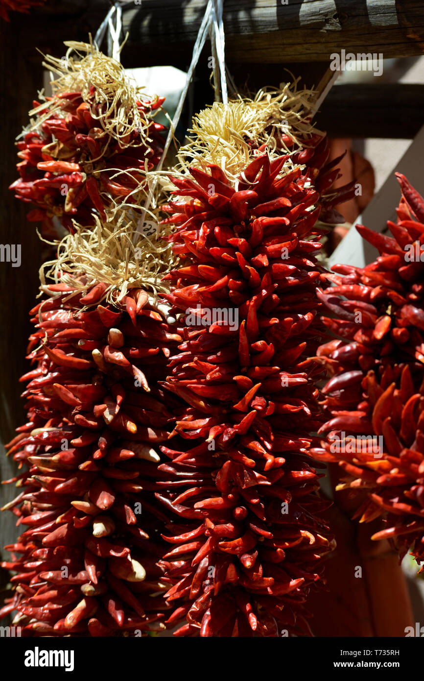 Strings of decorative dried red Chile peppers called ristras hanging in