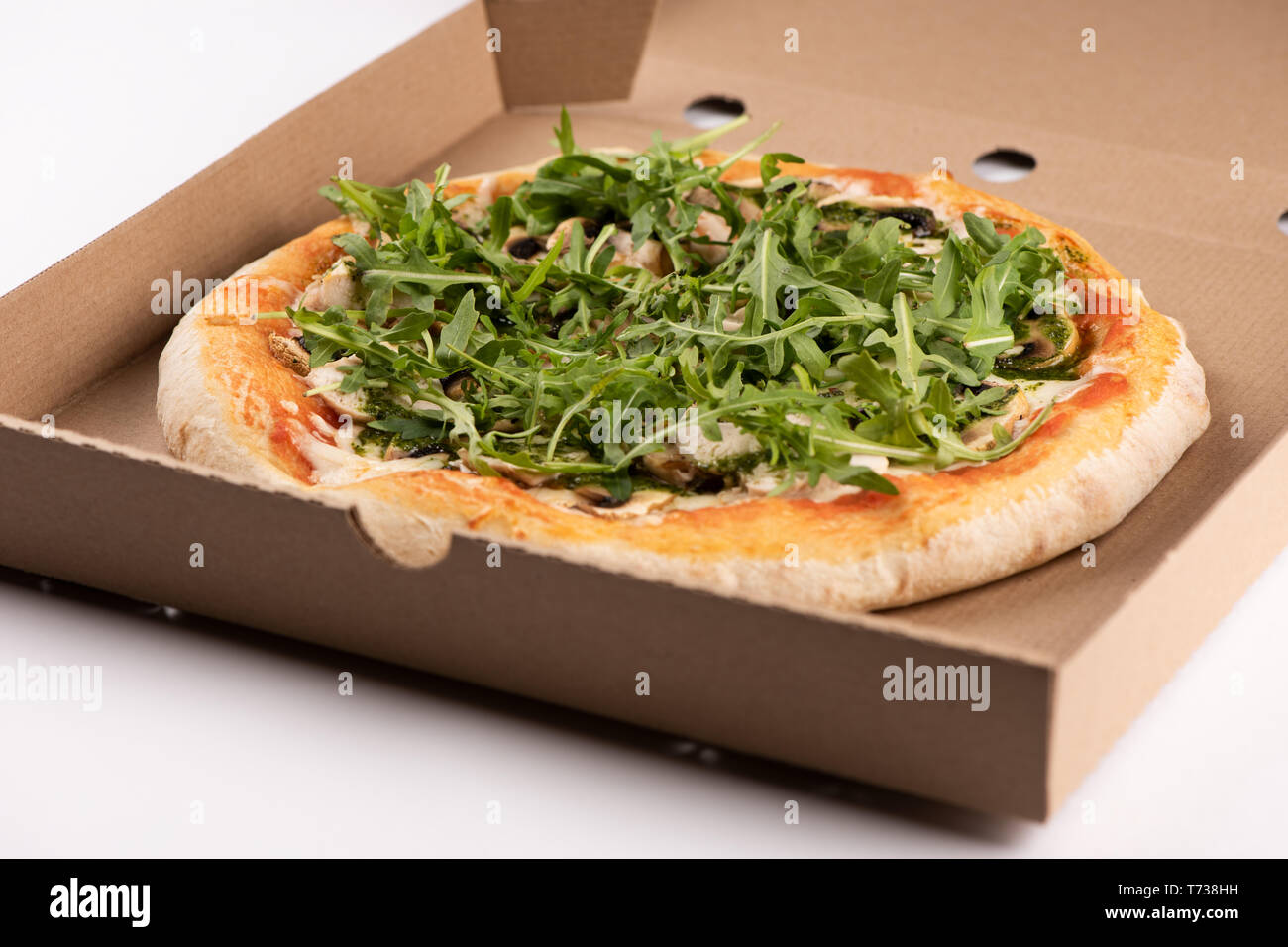 Pizza in a cardboard box close up Stock Photo