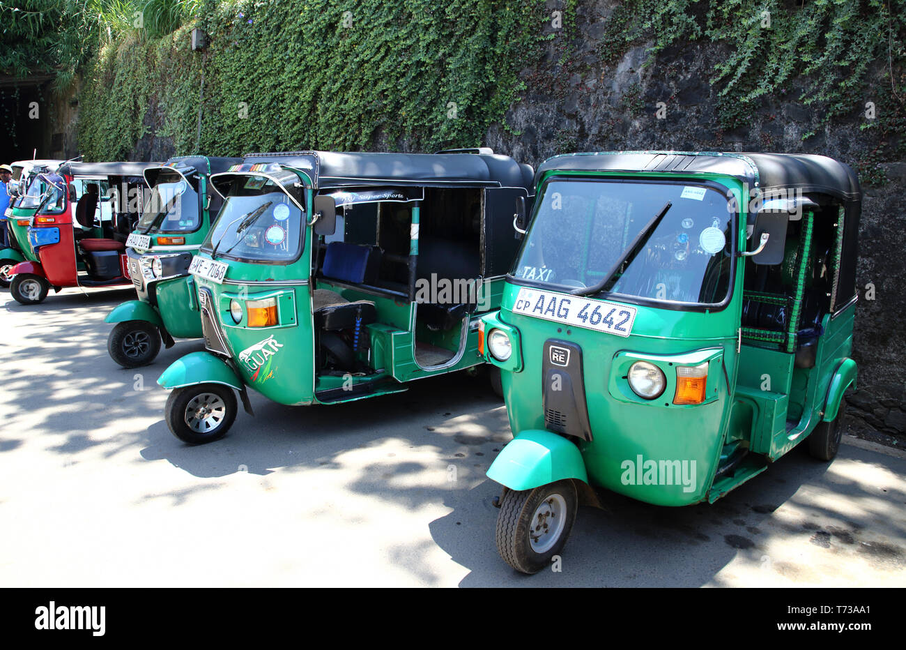 tuk tuk taxi traveling by train through the hill country at nanu-oya station in sri lanka Stock Photo