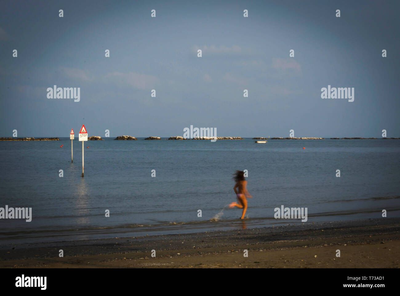 Girl Running On A Sandy Seafront Stock Photo 245321805 Alamy