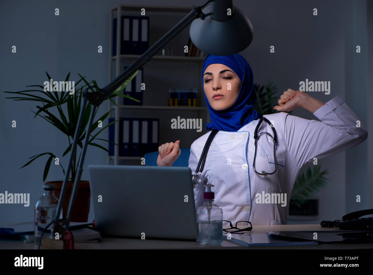 Tired female doctor sleeping in hi-res stock photography and images - Alamy