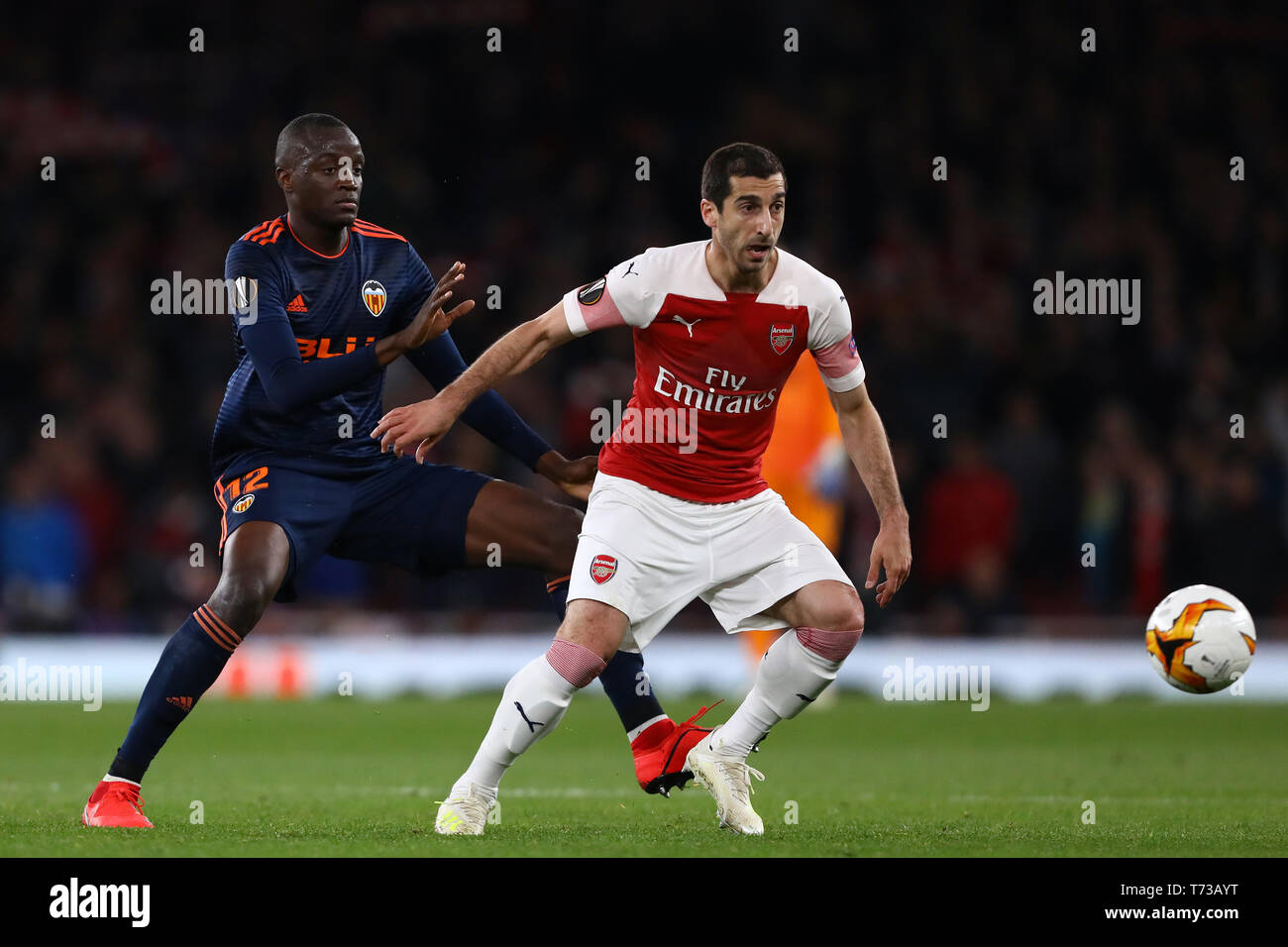 Henrikh Mkhitaryan of Arsenal and Mouctar Diakhaby of Valencia - Arsenal v Valencia, UEFA Europa League Semi Final - 1st Leg, Emirates Stadium, London Stock Photo