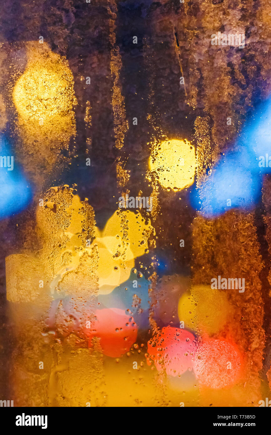 Rain drops on window with bokeh. Vertical composition Stock Photo - Alamy