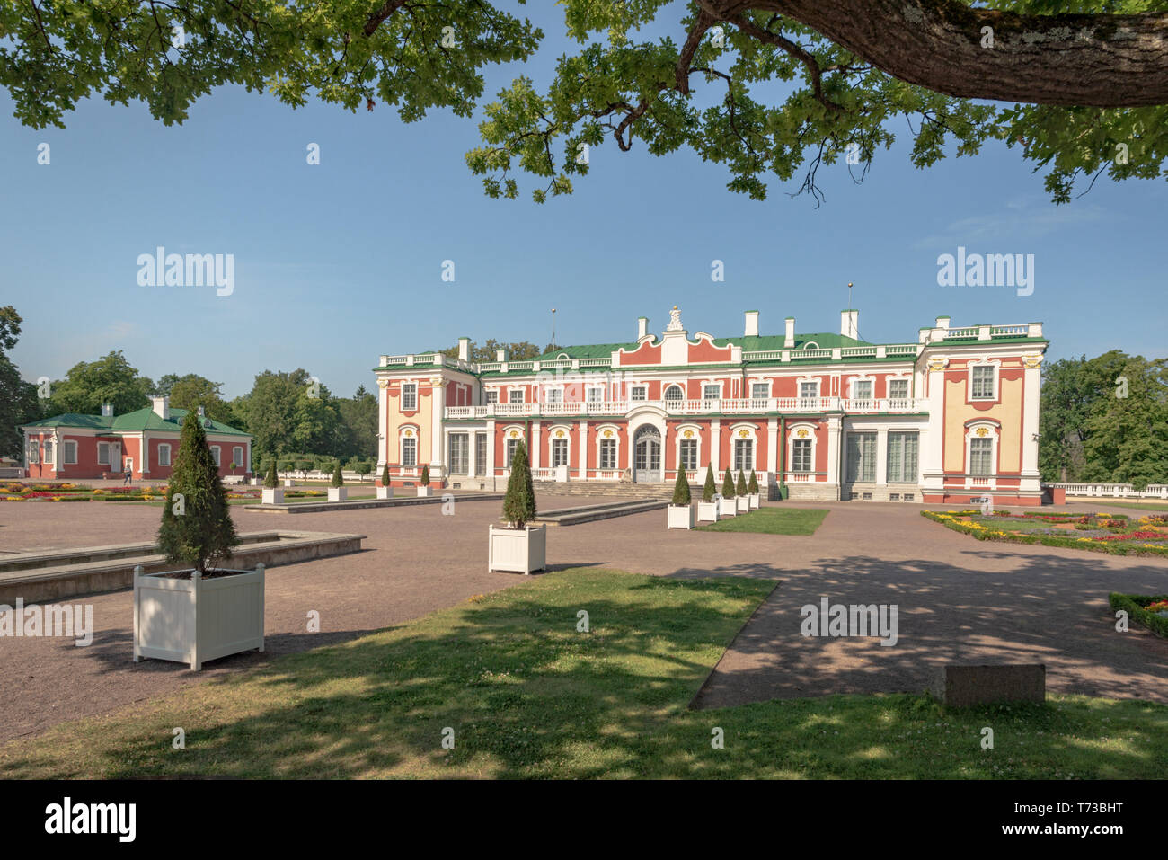 Oak branches framing a view of the Kadriorg palace on a summer afternoon, Tallinn, Estonia Stock Photo