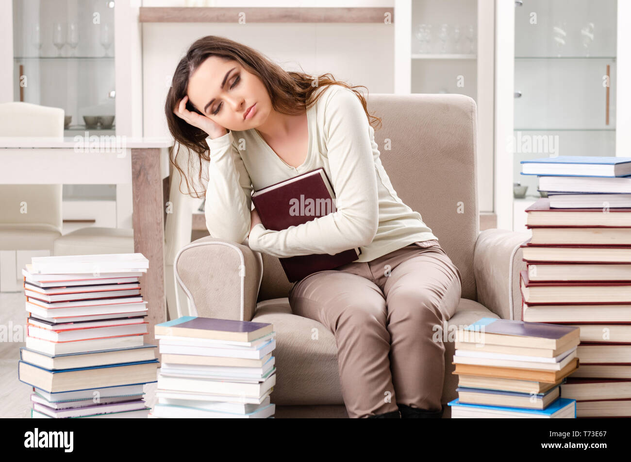 Young female student preparing for exams at home Stock Photo - Alamy