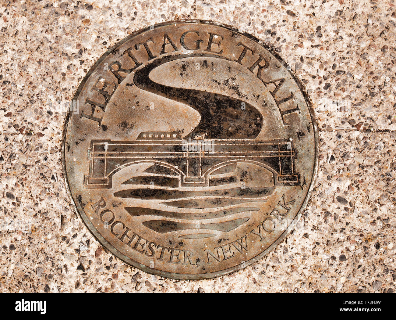 Rochester, New York, USA. April 25, 2019. Sidewalk plaque marking a portion of the 1.25 mile Heritage Trail in downtown Rochester, New York Stock Photo