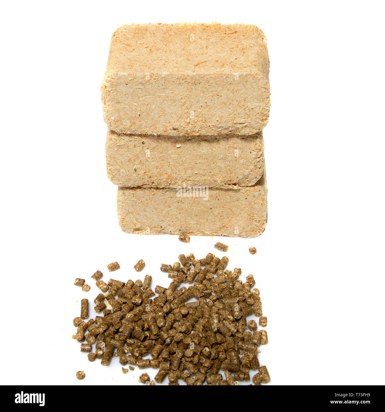 sawdust briquettes and pellets on white background Stock Photo