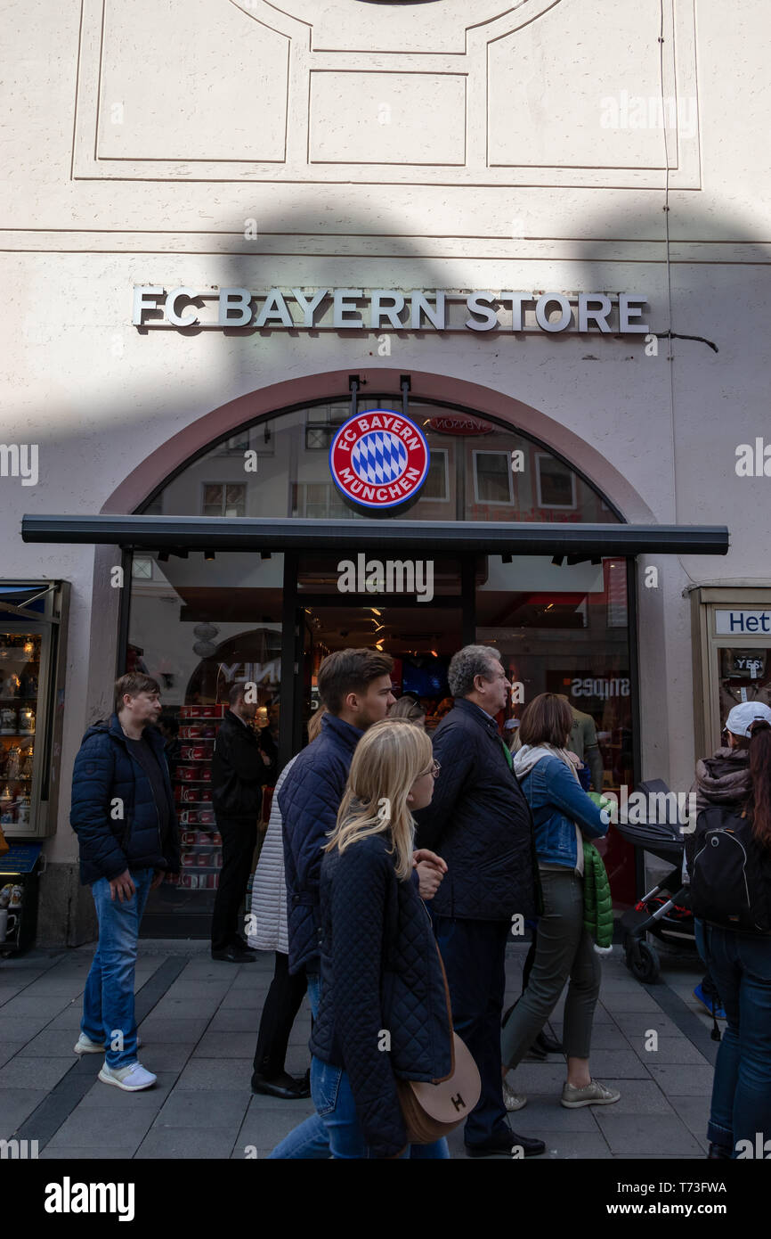 MARIENPLATZ, MUENCHEN, APRIL 6, 2019: trourist walking in and out of the FC Bayern store Stock Photo