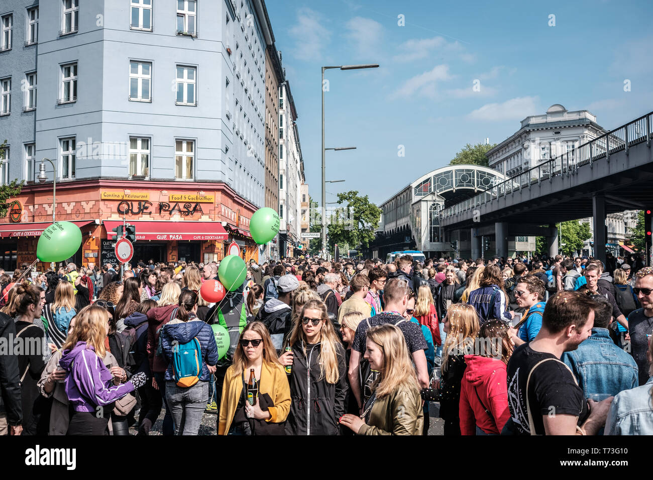 Berlin, Germany - May 01, 2019: Happy young people on crowded street celebrating labor day in Berlin, Kreuzeberg Stock Photo