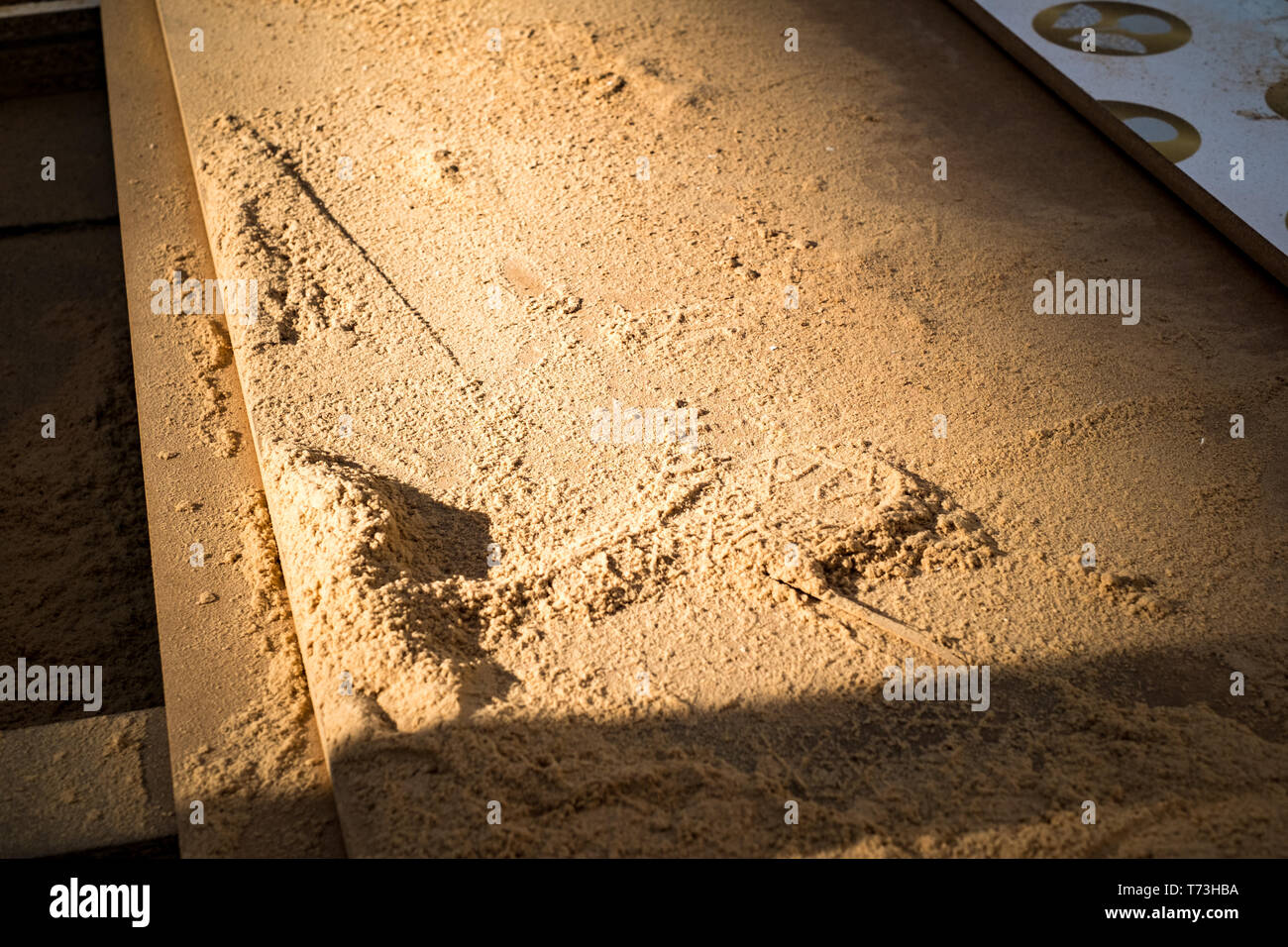 MDF wooden boards and sawdust at sunset Stock Photo Alamy