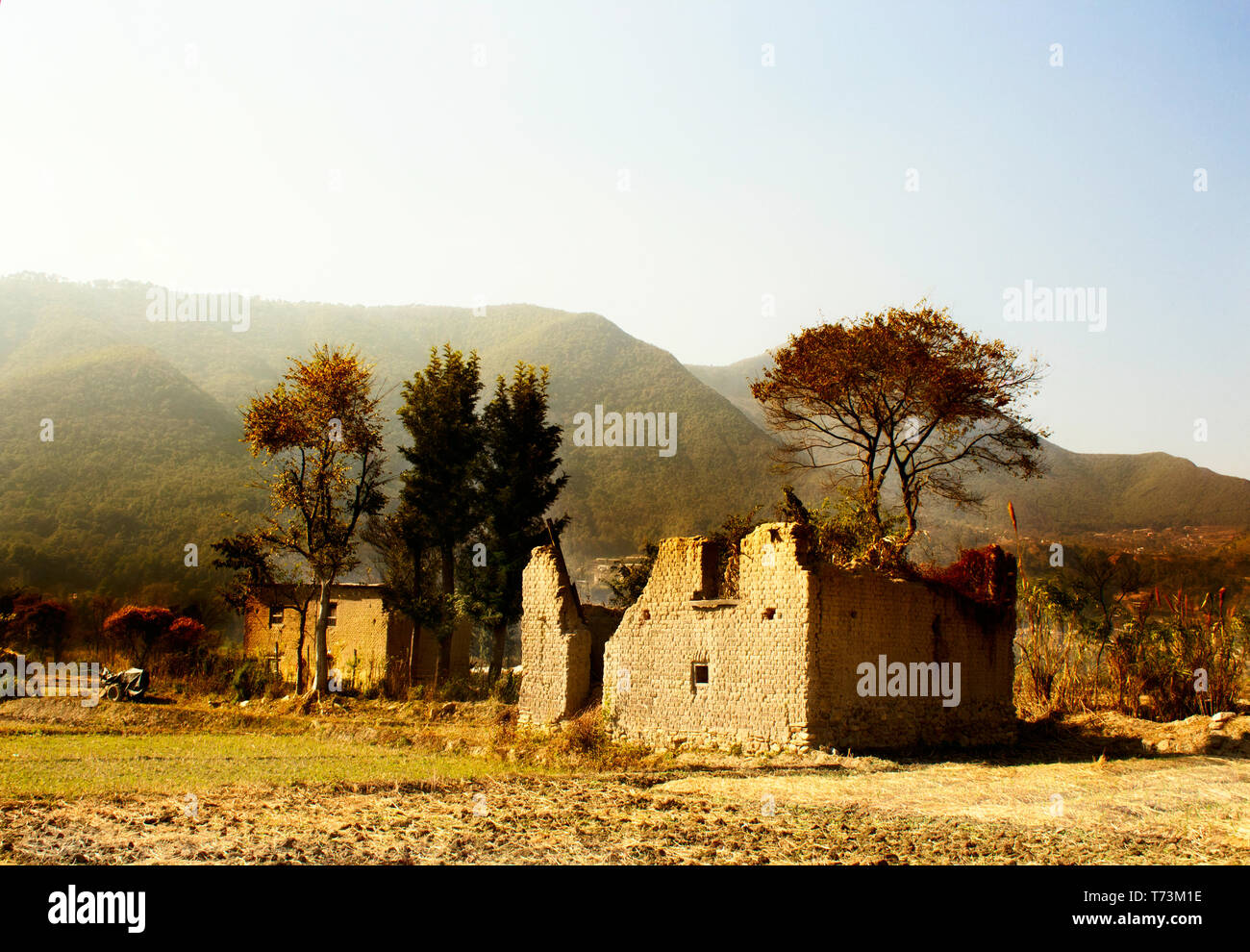 A damaged house and hills Stock Photo
