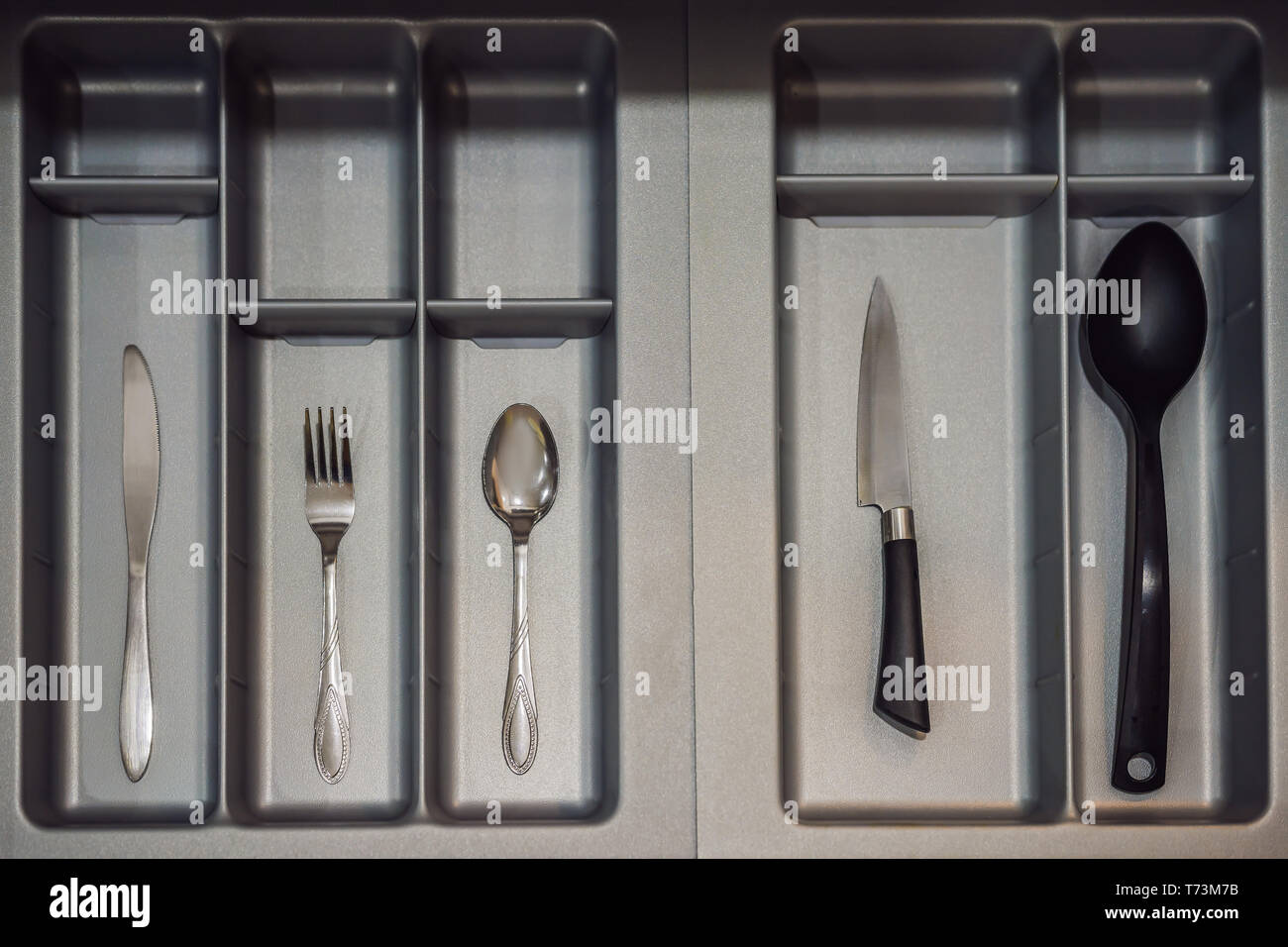 Minimalist kitchen. Only the most necessary. Spoon, fork, knife Stock
