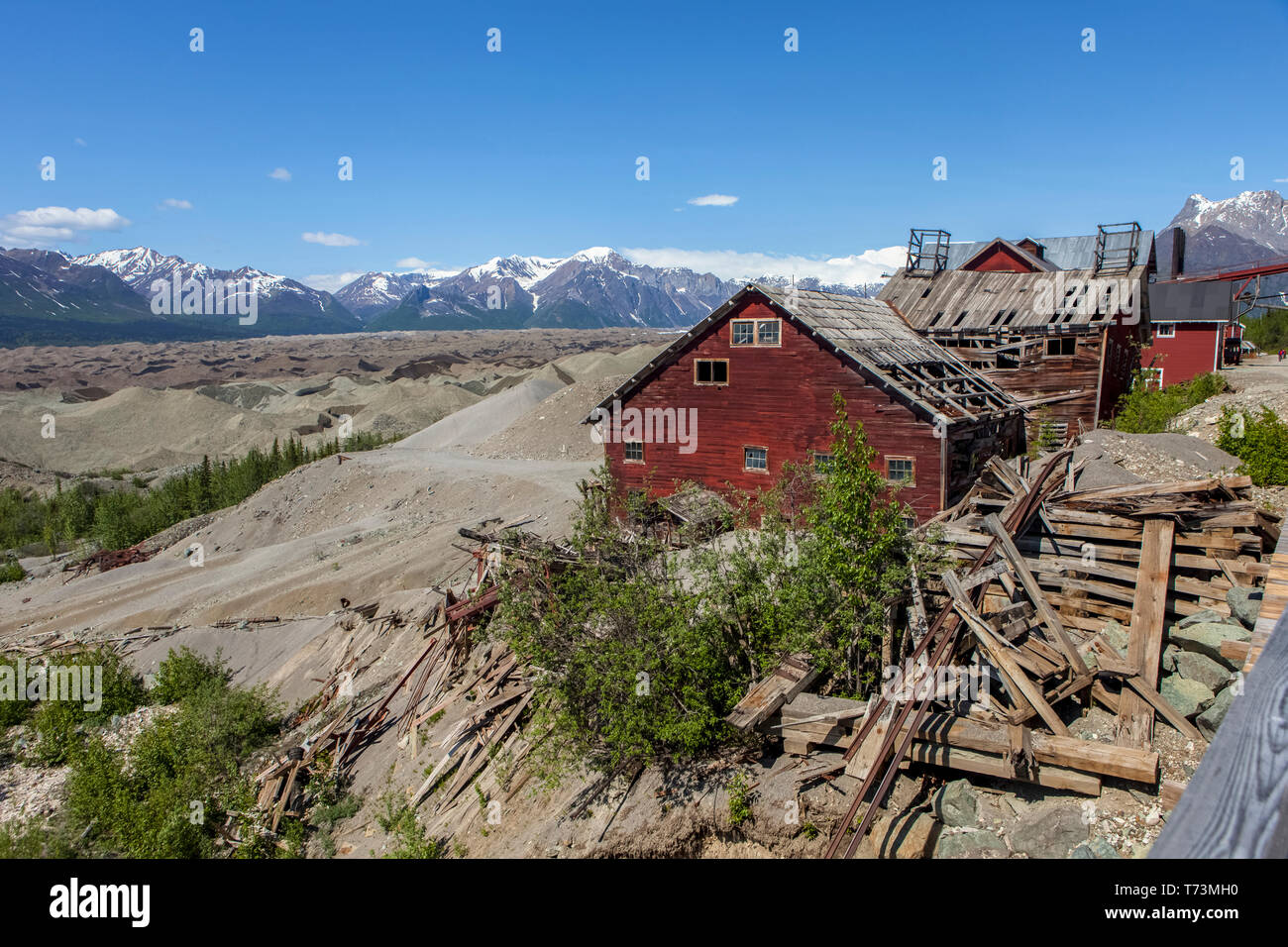 Kennicott Mine buildings with Root Glacier moraine and Wrangell Mountains in background in the Wrangell–St. Elias National Park and Preserve, South... Stock Photo